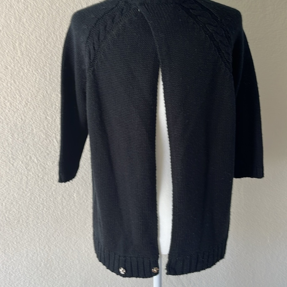 Zara short sleeve sweater in black.  Open back with snap closure at bottom. Med.